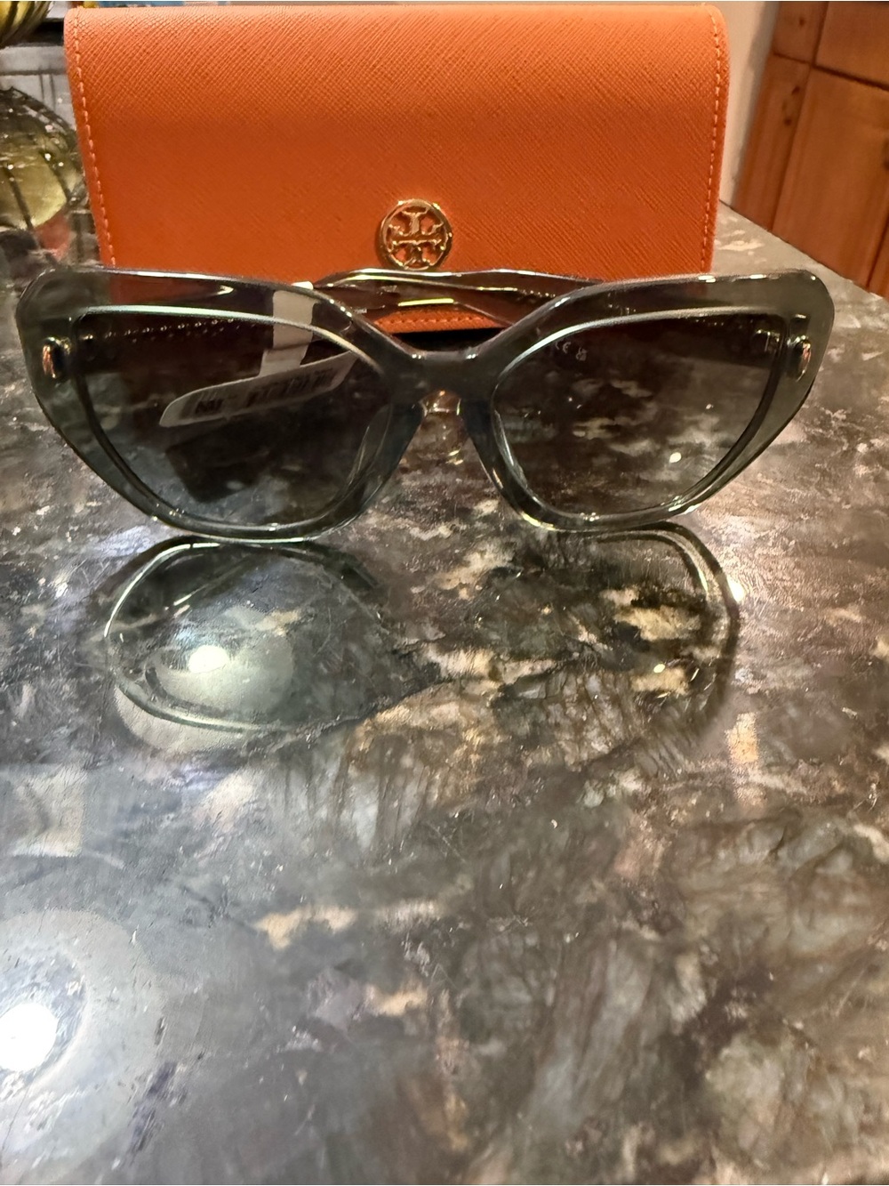 Tory Burch Women’s Translucent Gray Cat-Eye Sunglasses with Orange Logo Case